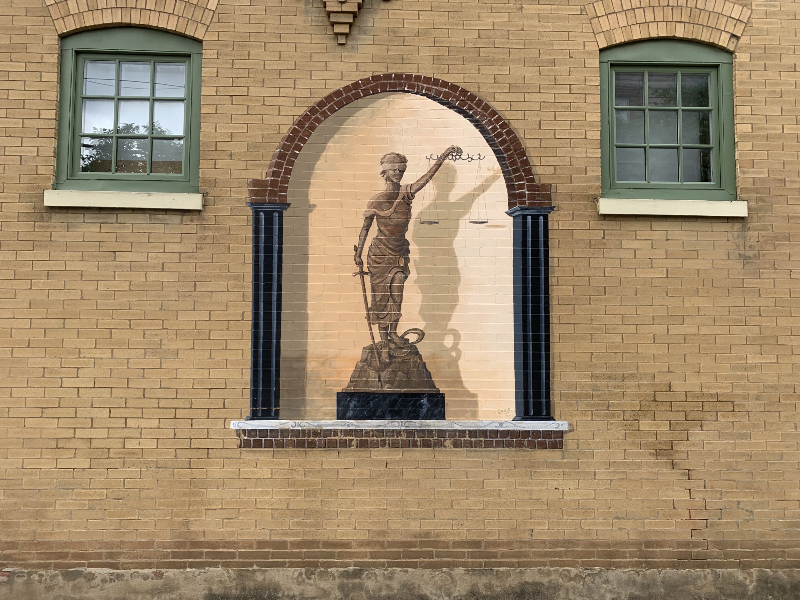 Lady Liberty mural on a brick wall