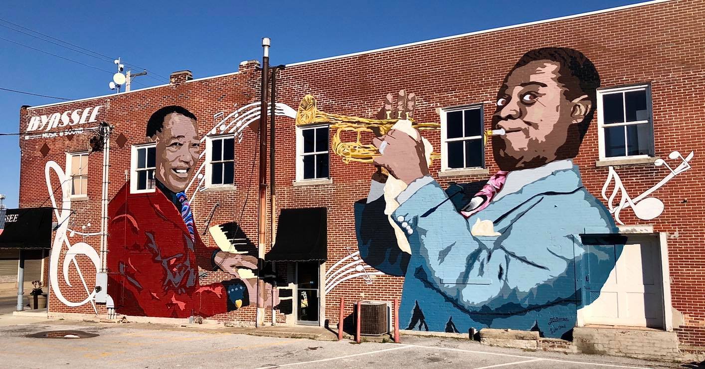 two large jazz musicians playing instruments as a mural in downtown marion illinois