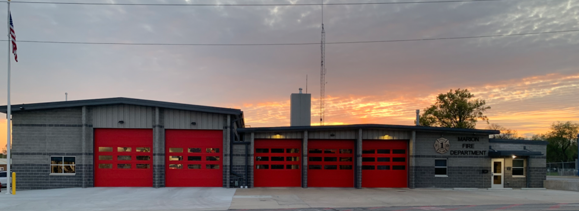 maron fire department with the sun setting in the background
